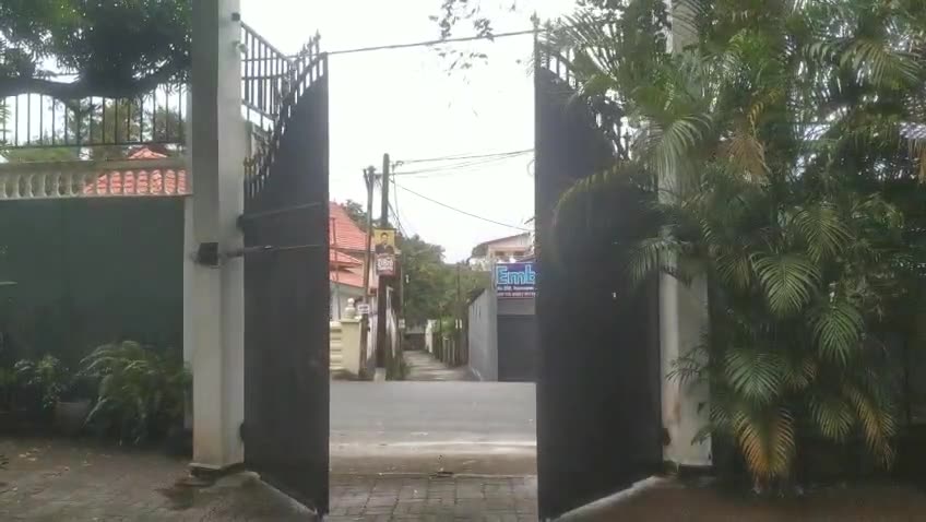 Arched double swing gate with auto gate motor installed by Keynode in Sri Lanka